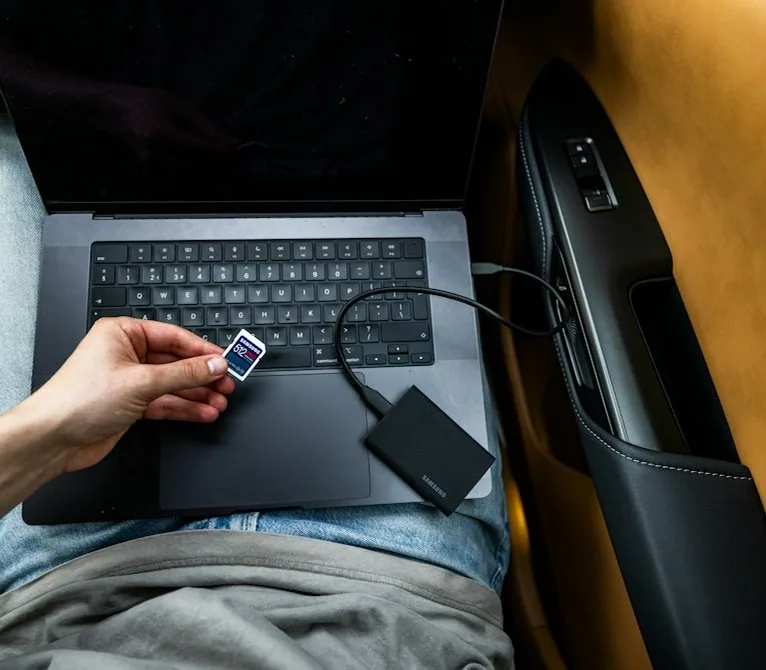 a laptop plugged into a car